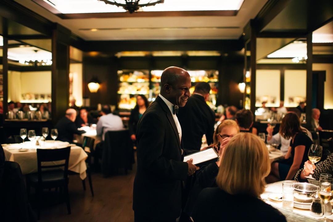 a server greets a table