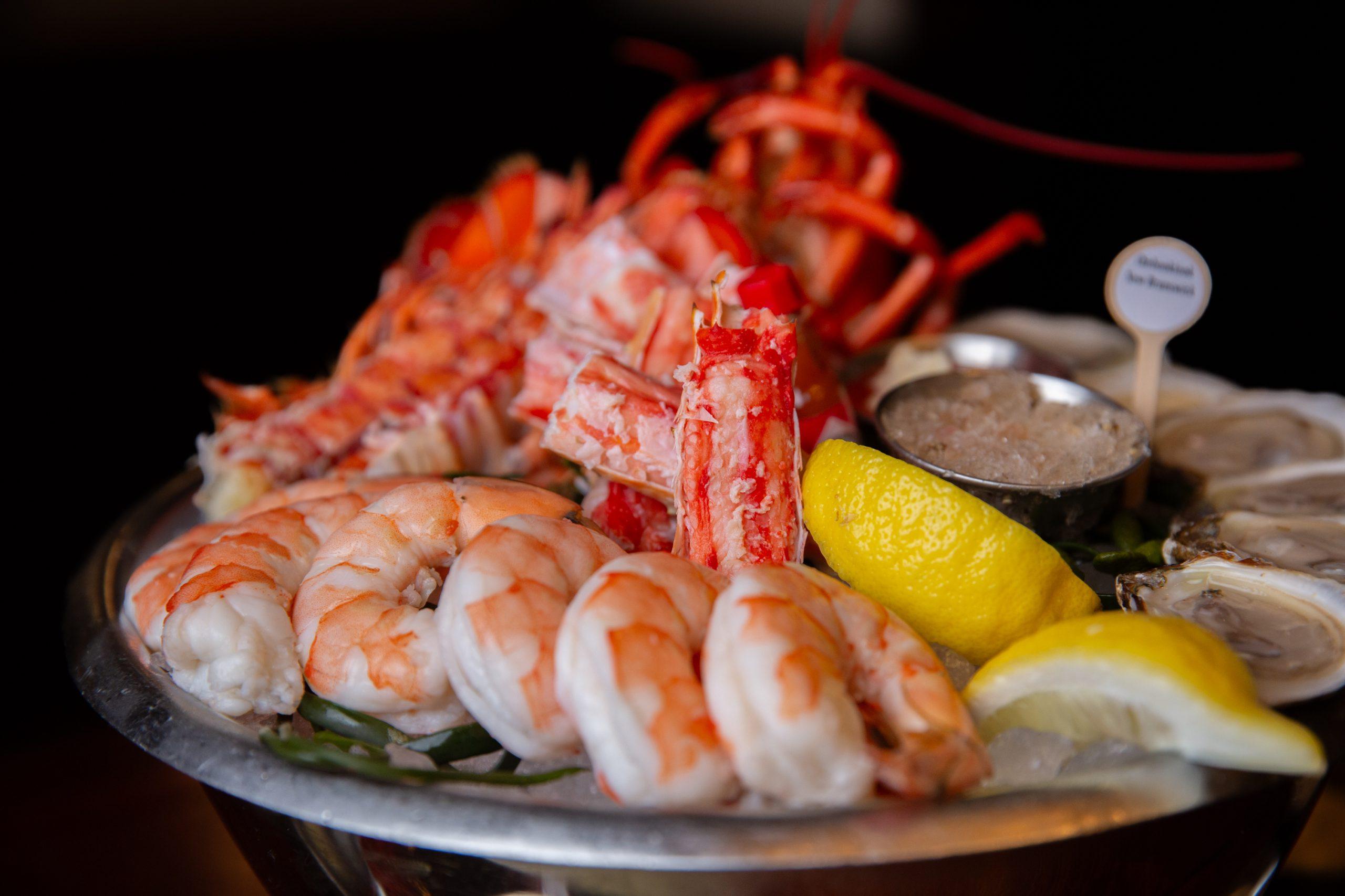 the joe's whale with shellfish - shrimp, lemon, oysters on the half shell, and king crab