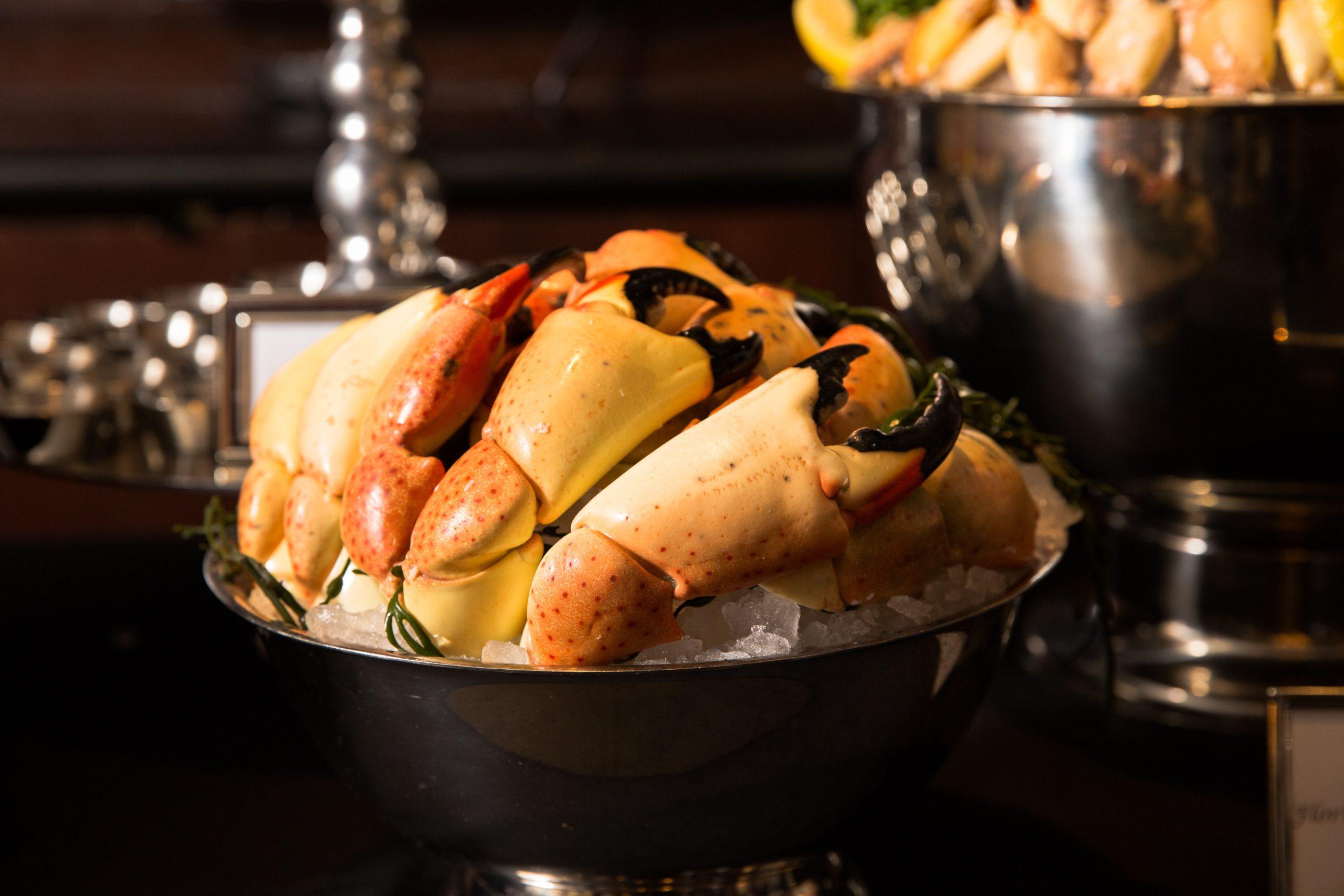 crab claws served on a bowl of ice