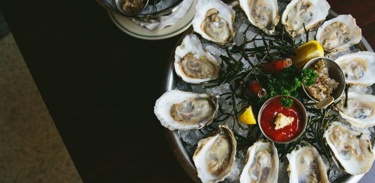 oysters on the half shell with seaweed 